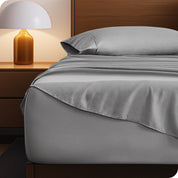 A cozy bedroom with a bed covered in soft microfiber sheets