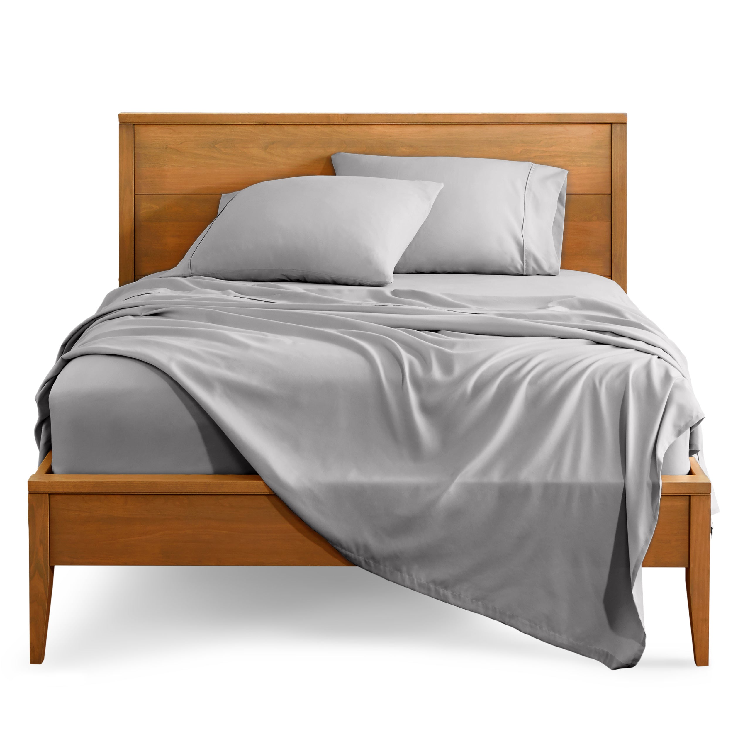 Microfiber sheet set on a bed with a wooden bed frame