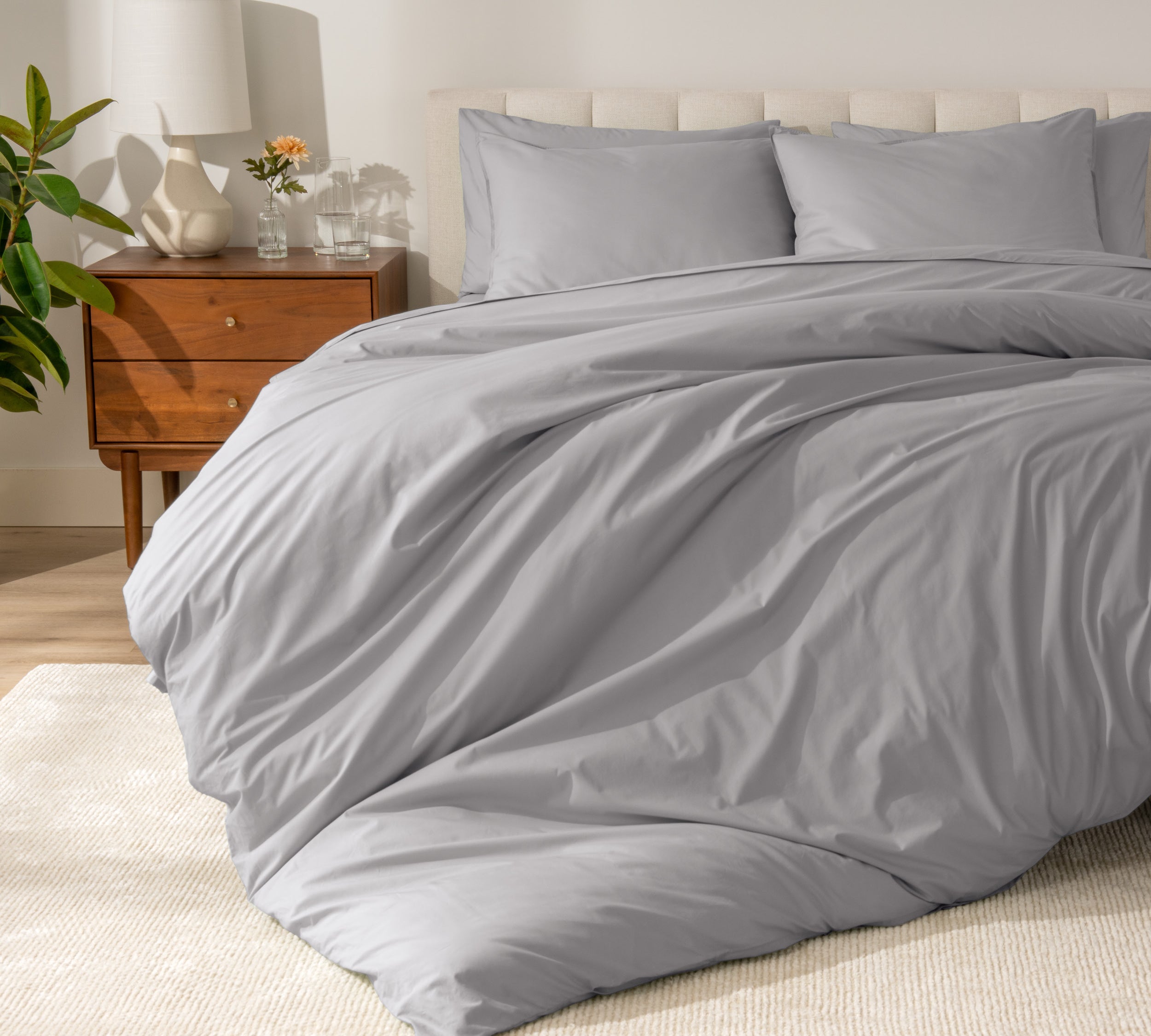 A modern bed with a organic cotton percale duvet cover on.