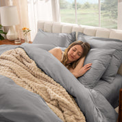 A women sleep on the bed with organic cotton percale duvet cover and pillowcases.