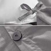 A close view of the corner tie of the duvet cover and the buttons for pillow shams