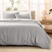 Warm bright room scene showing Sateen Duvet Set  laid out over the bed