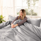 A modern bed with a sateen duvet cover set consisting of the duvet cover and two pillows.