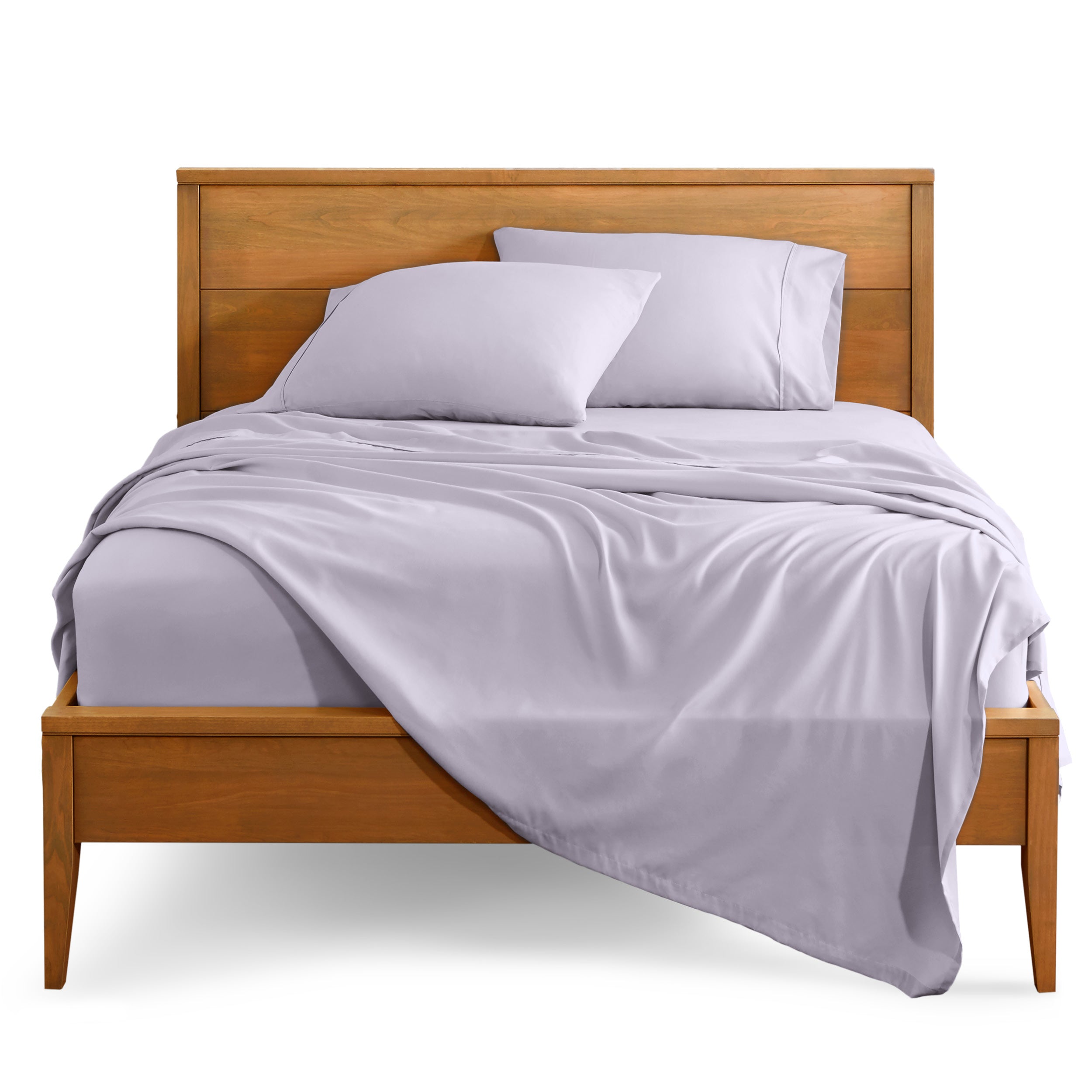 Microfiber sheet set on a bed with a wooden bed frame