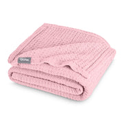 A cotton waffle blanket folded
