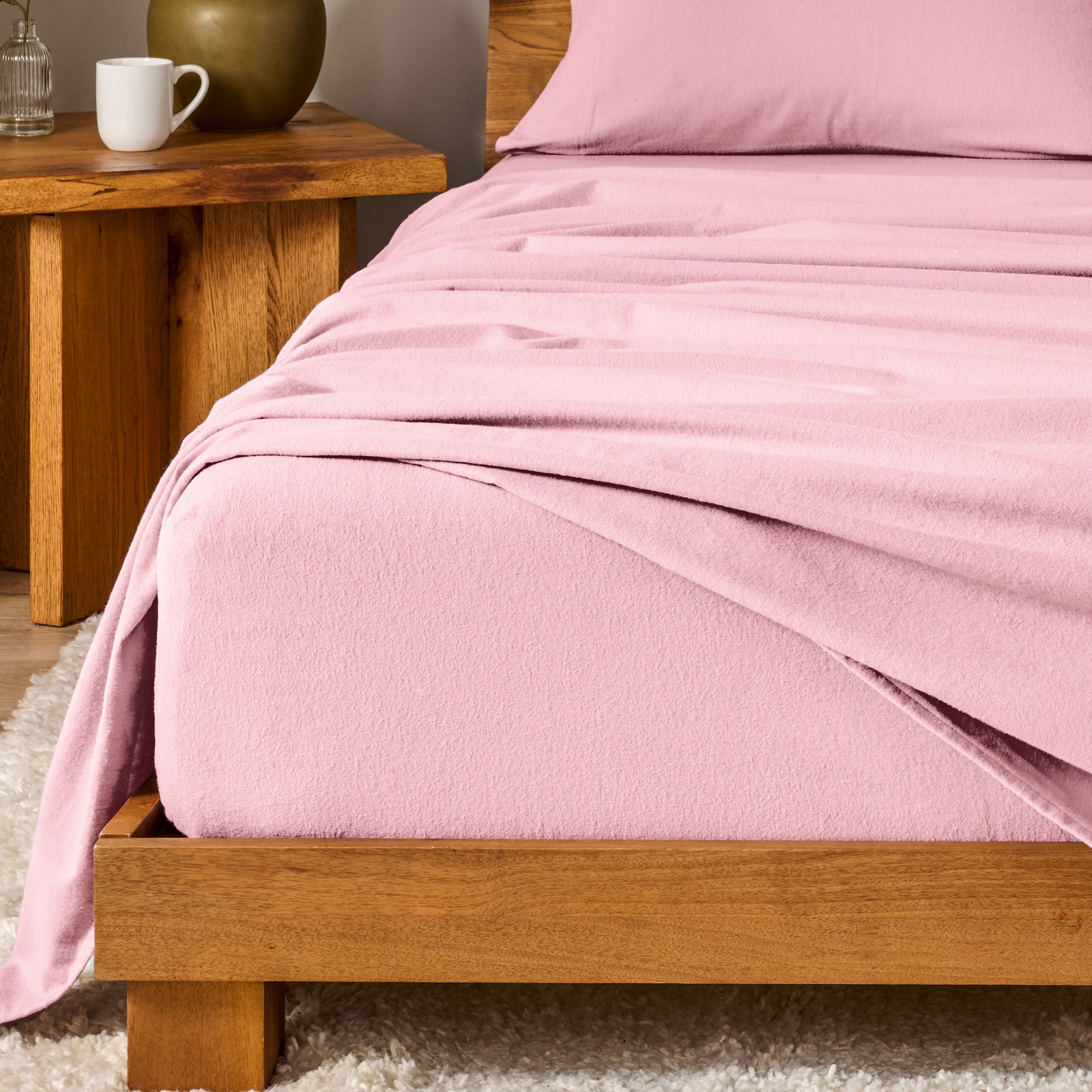 A modern bedroom with cotton flannel sheets on the bed