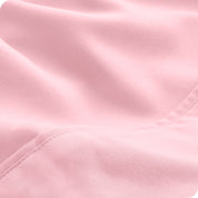 Close-up of the fabric and its neatly finished edge.