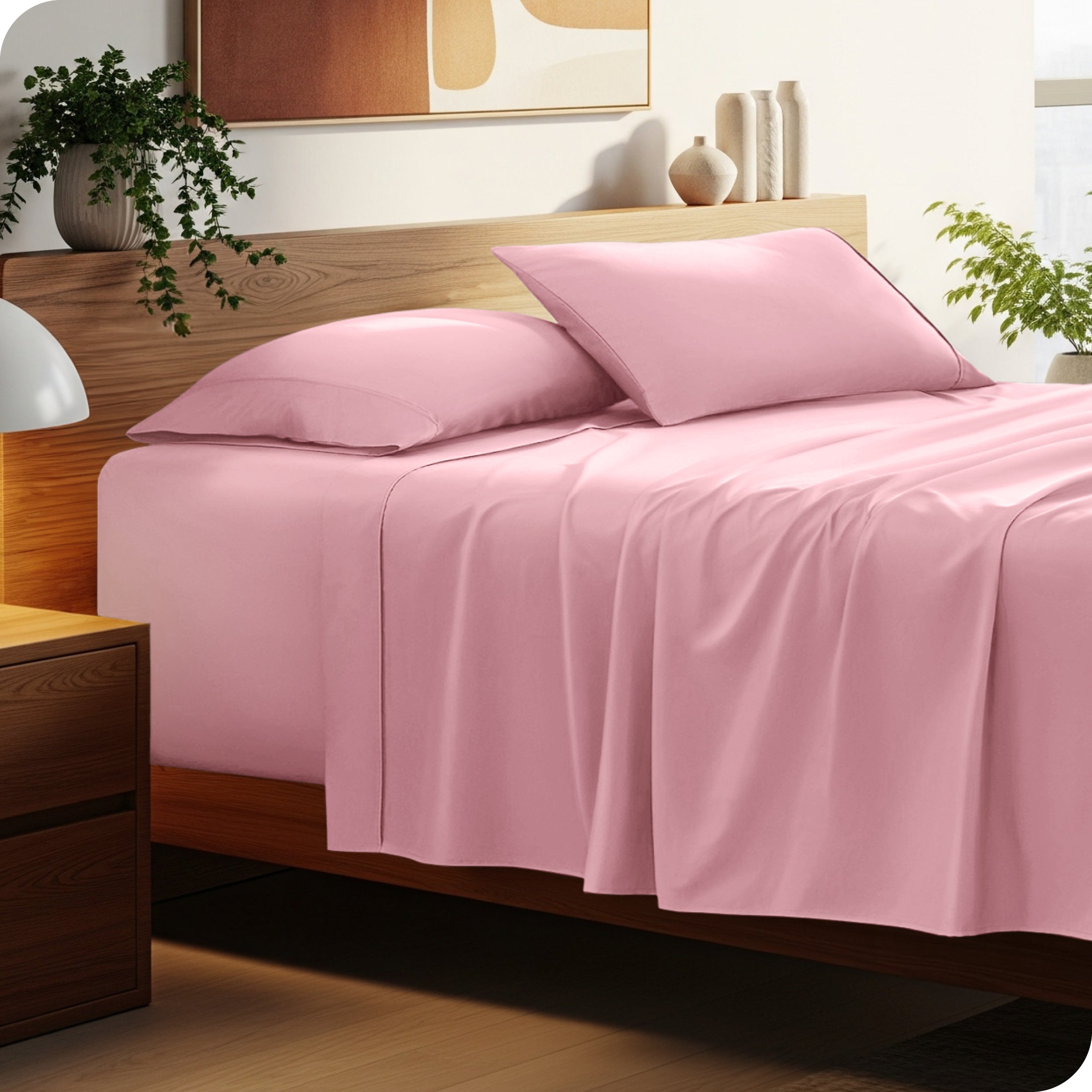 A cozy bedroom featuring a neatly made bed with soft, microfiber sheets