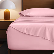 A cozy bedroom with a bed covered in soft microfiber sheets