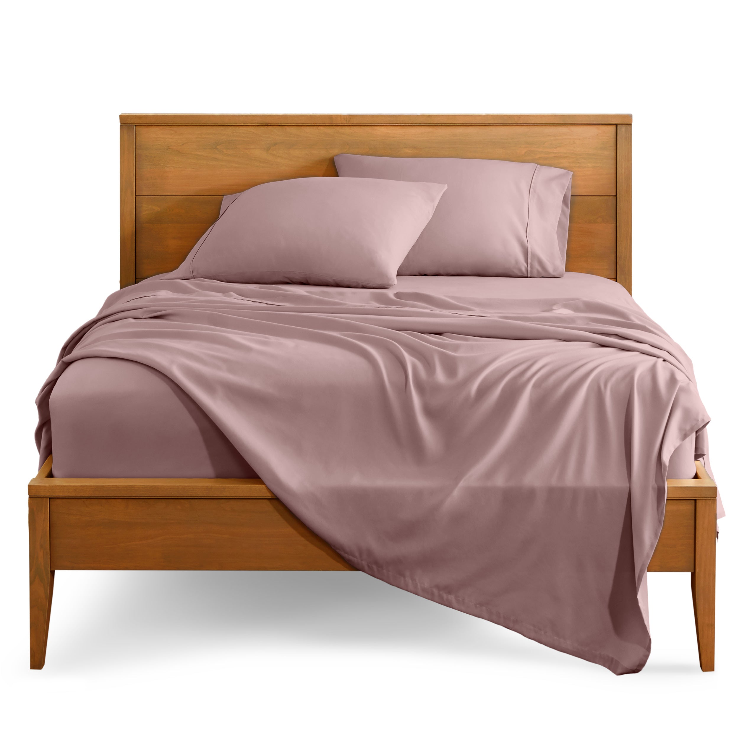 Microfiber sheet set on a bed with a wooden bed frame
