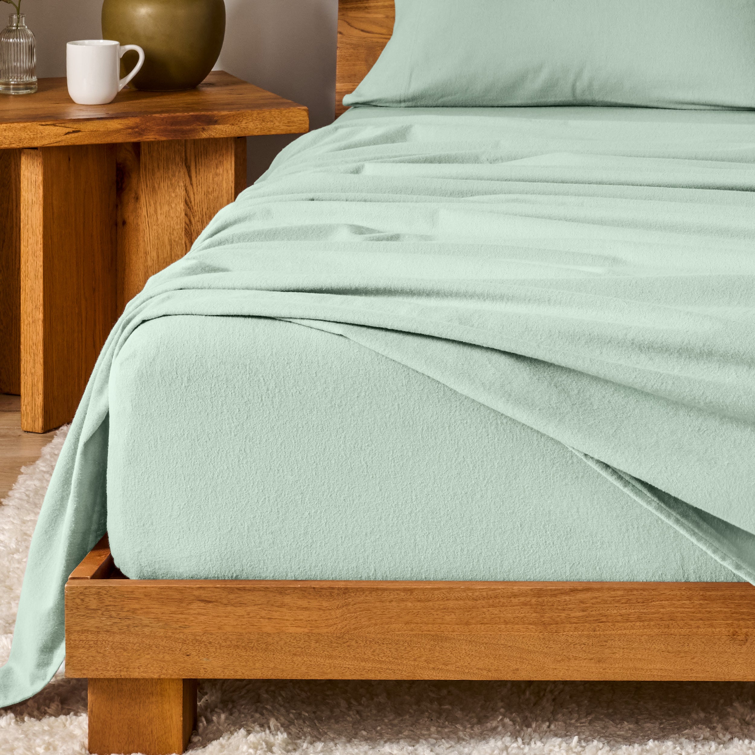 A modern bedroom with cotton flannel sheets on the bed