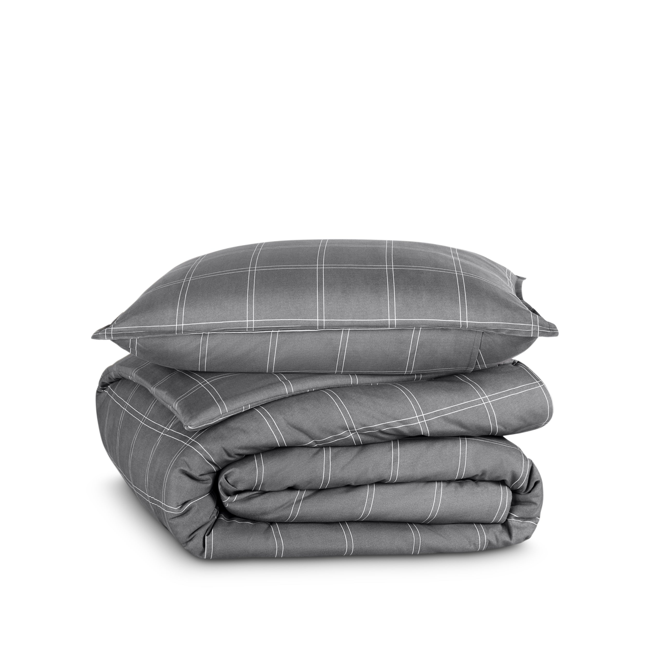 A comforter folded with a matching pillow sham stacked on top