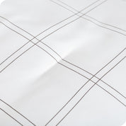 A close up of a track stitch comforter