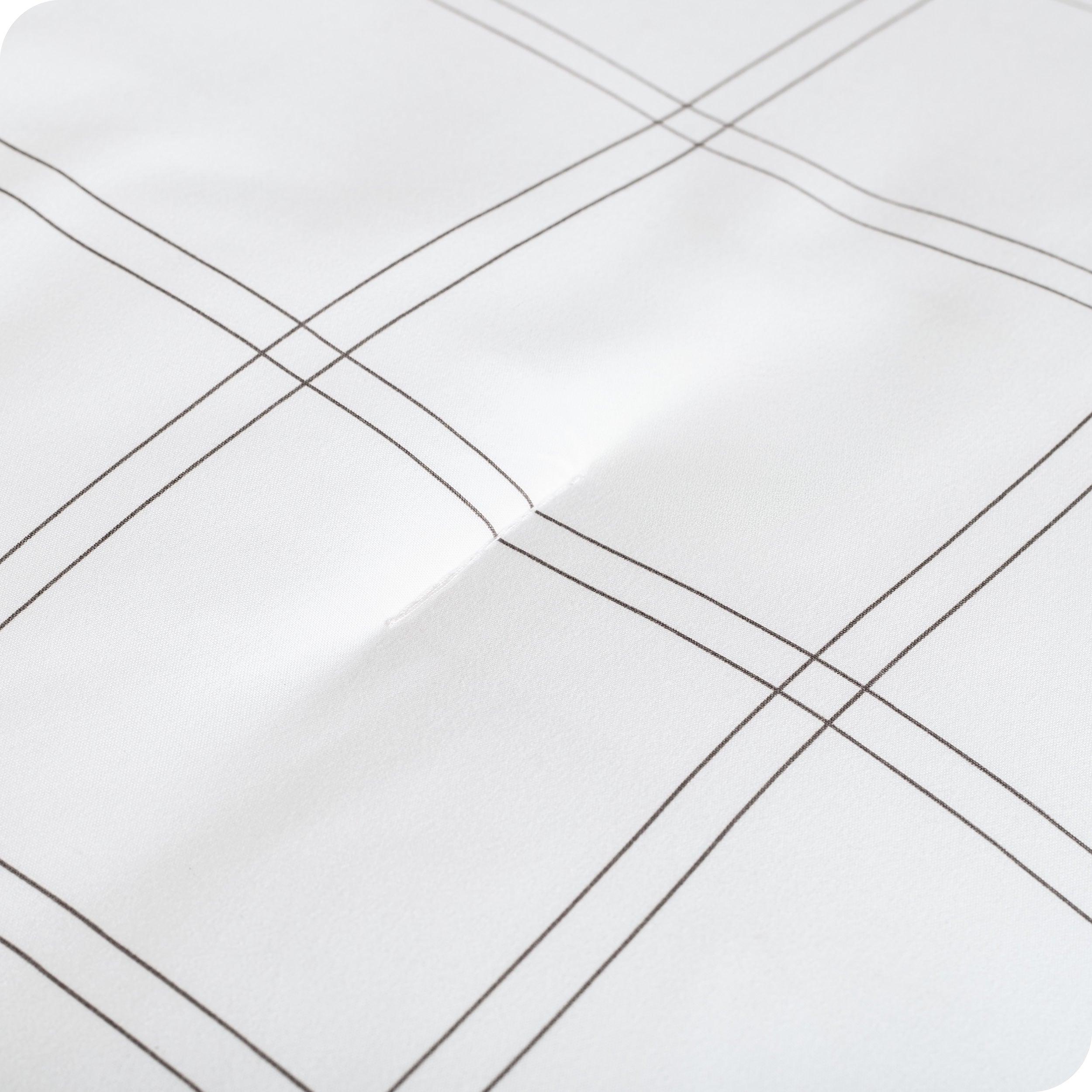 A close up of a track stitch comforter