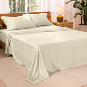 TENCEL™ sheet set on a bed. The flat sheet is draped over the side and end of the bed.