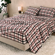 A bed made with cotton flannel sheets