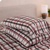 Printed flannel pillowcases and sheets on a bed
