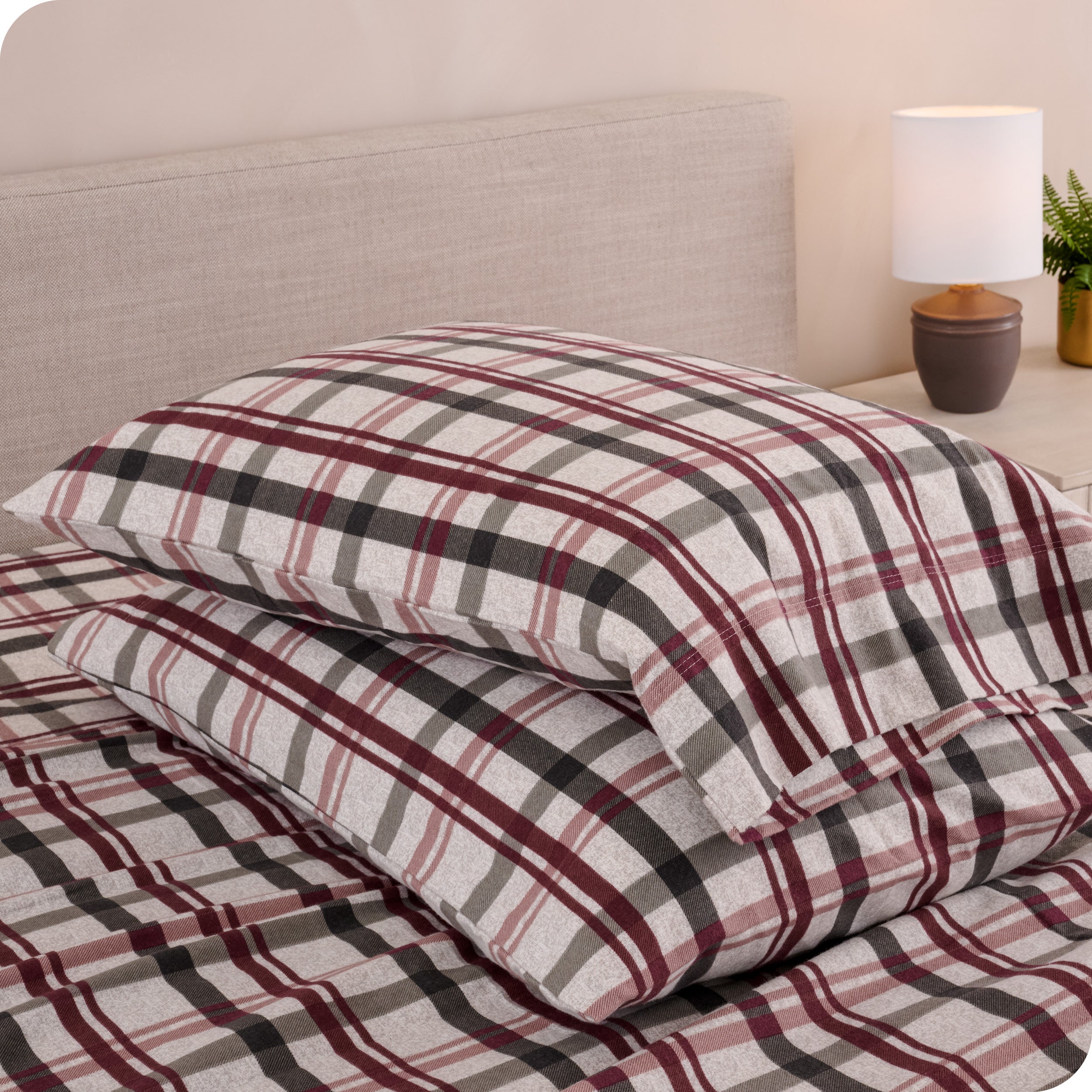Printed flannel pillowcases and sheets on a bed