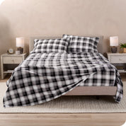 A bed made with cotton flannel sheets