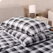 Printed flannel pillowcases and sheets on a bed