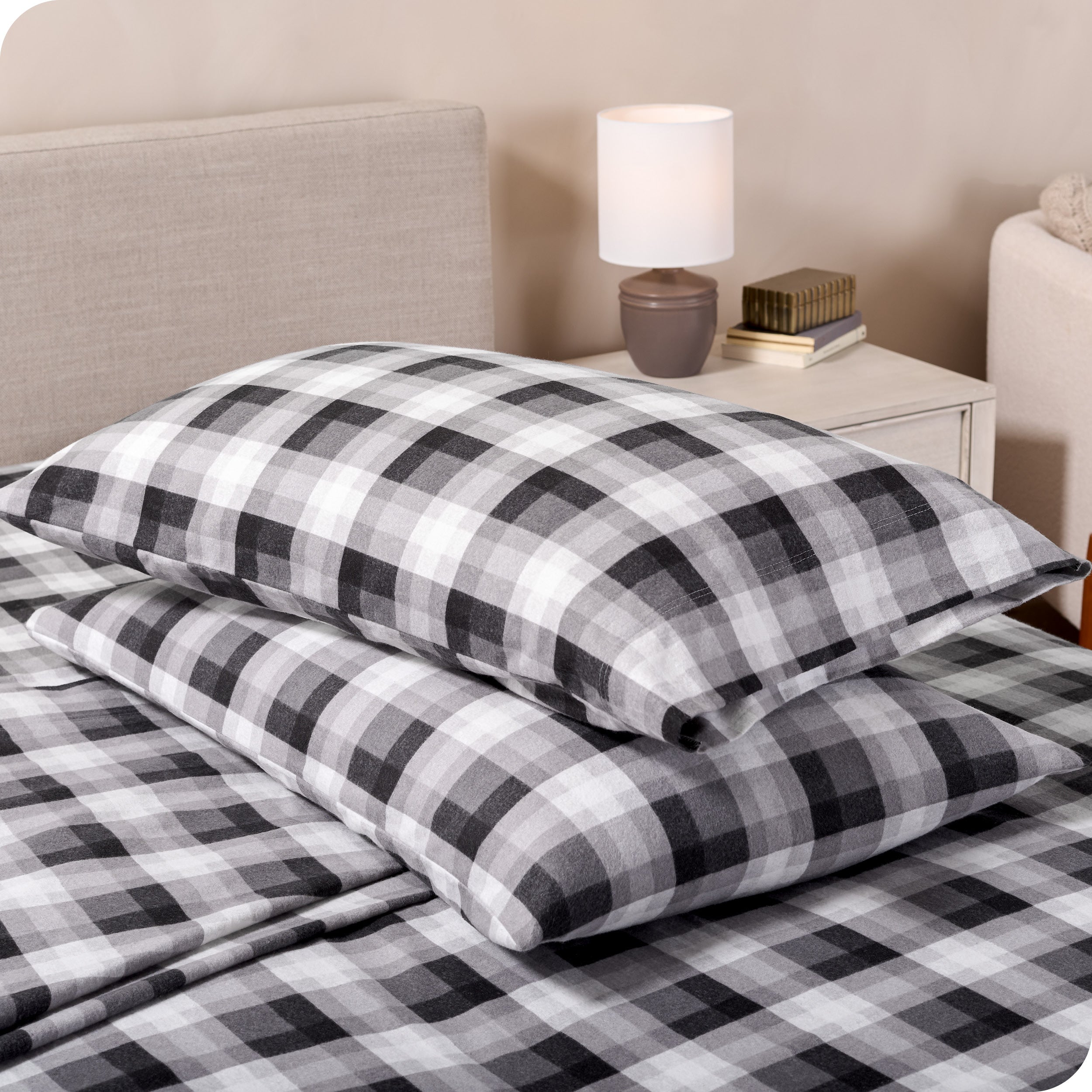 Printed flannel pillowcases and sheets on a bed