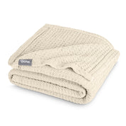 A cotton waffle blanket folded