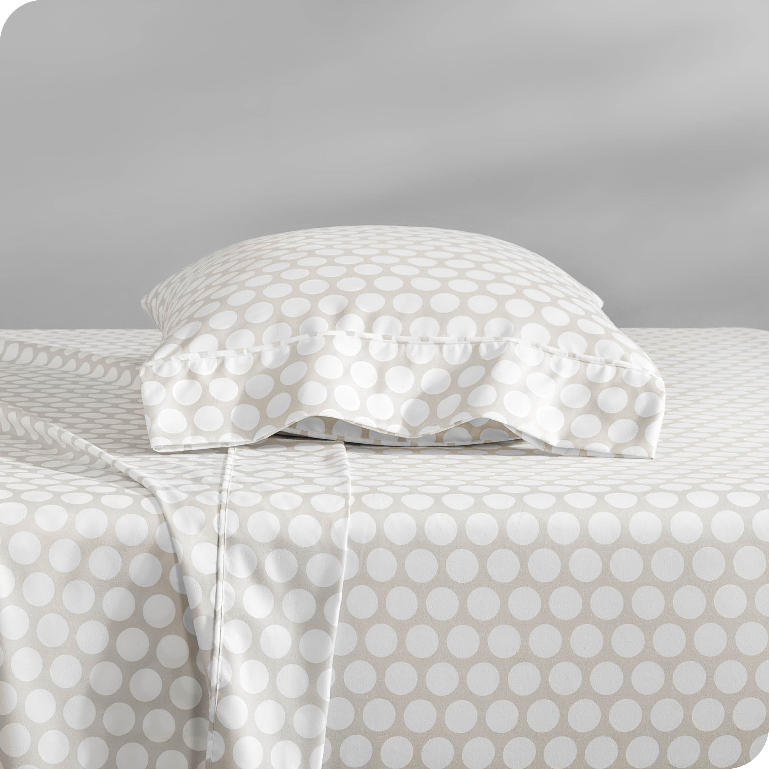 A sideview of a modern bed with a printed microfiber sheet set.