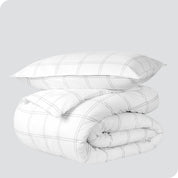 A duvet cover set folded and stacked.