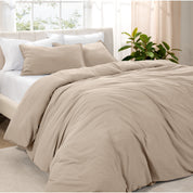 Angled view of bed with a duvet cover folded over on itself