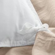 Close up of cloth ties for attaching duvet insert to inside of duvet cover