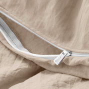 Close up of the zipper on the duvet cover partially opened
