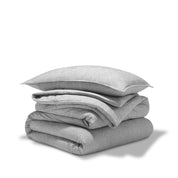 A comforter folded with a matching pillow sham stacked on top
