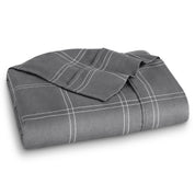 Neatly folded printed microfiber flat sheet with corner folded over.