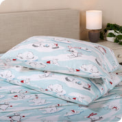 Printed flannel pillowcases and sheets on a bed
