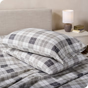 Printed flannel pillowcases and sheets on a bed