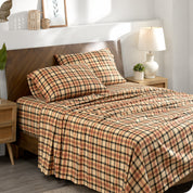 Plaid flannel sheets on a bed