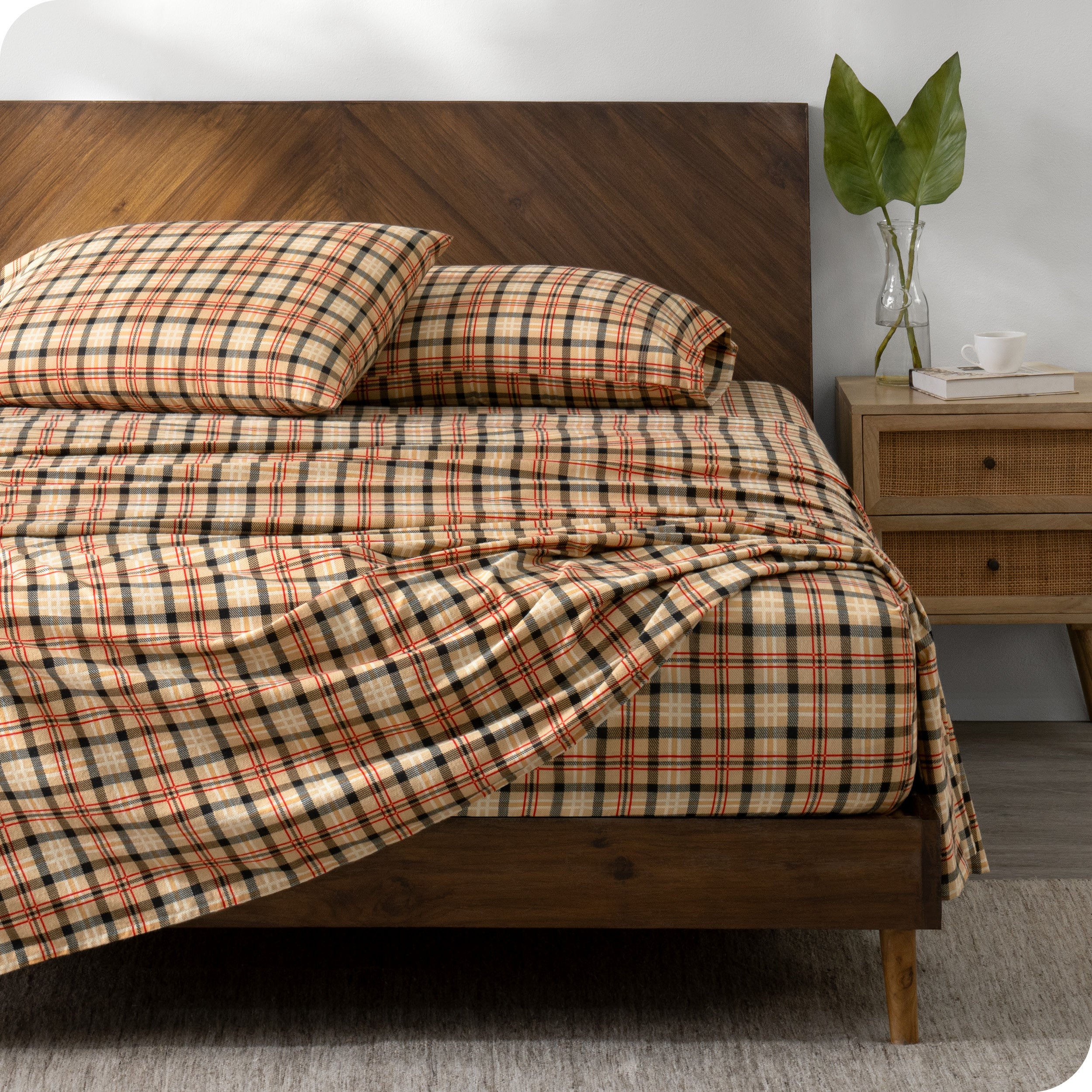 A bed made with cotton flannel sheets