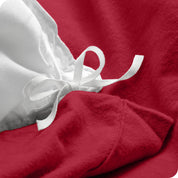 A close up of the corner ties used to attach the duvet cover to the insert.
