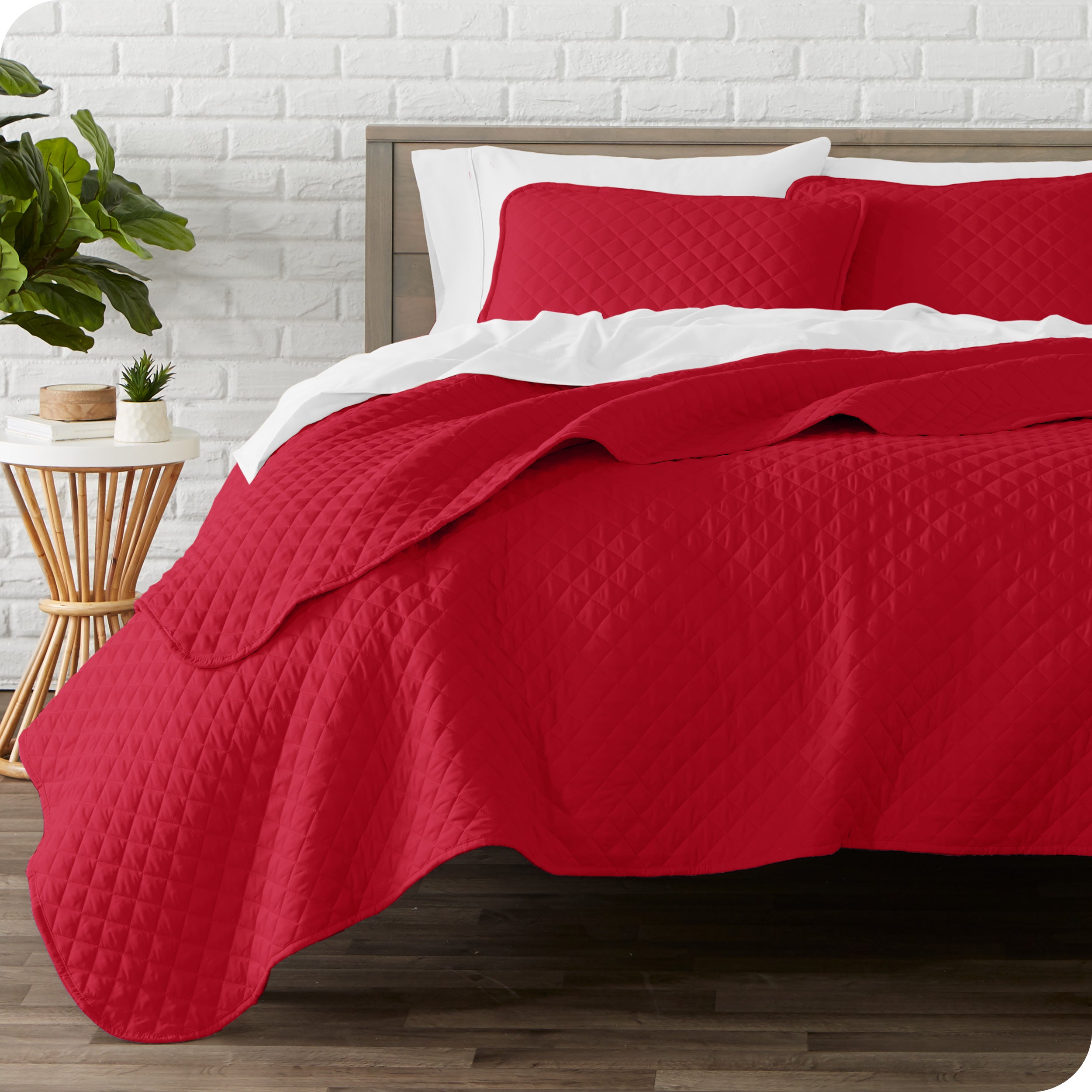 A quilted coverlet set on a bed