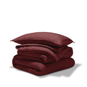 A comforter folded with a matching pillow sham stacked on top