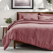 A bedding set on a bed in a modern bedroom