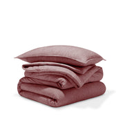 A comforter folded with a matching pillow sham stacked on top
