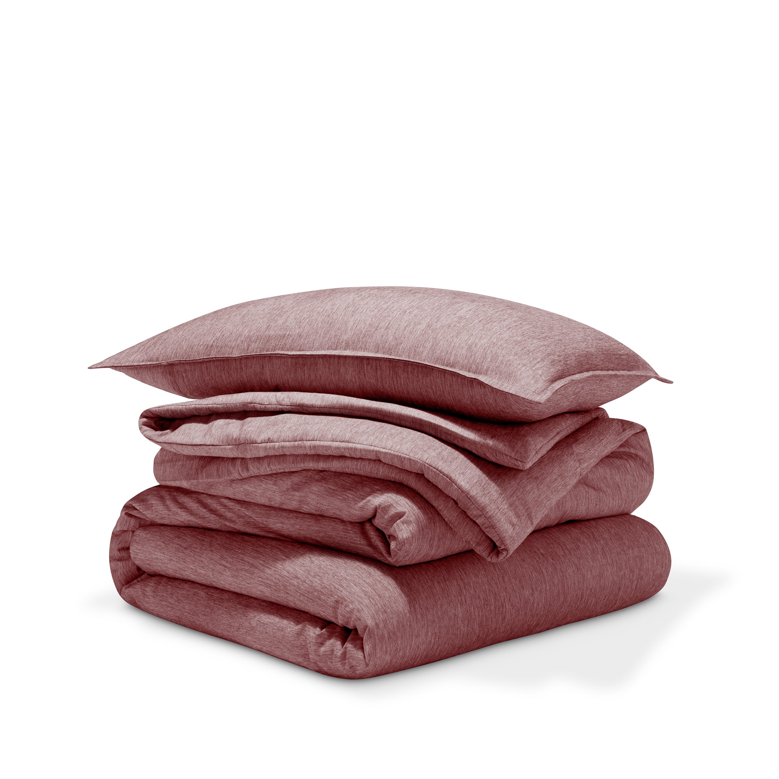 A comforter folded with a matching pillow sham stacked on top