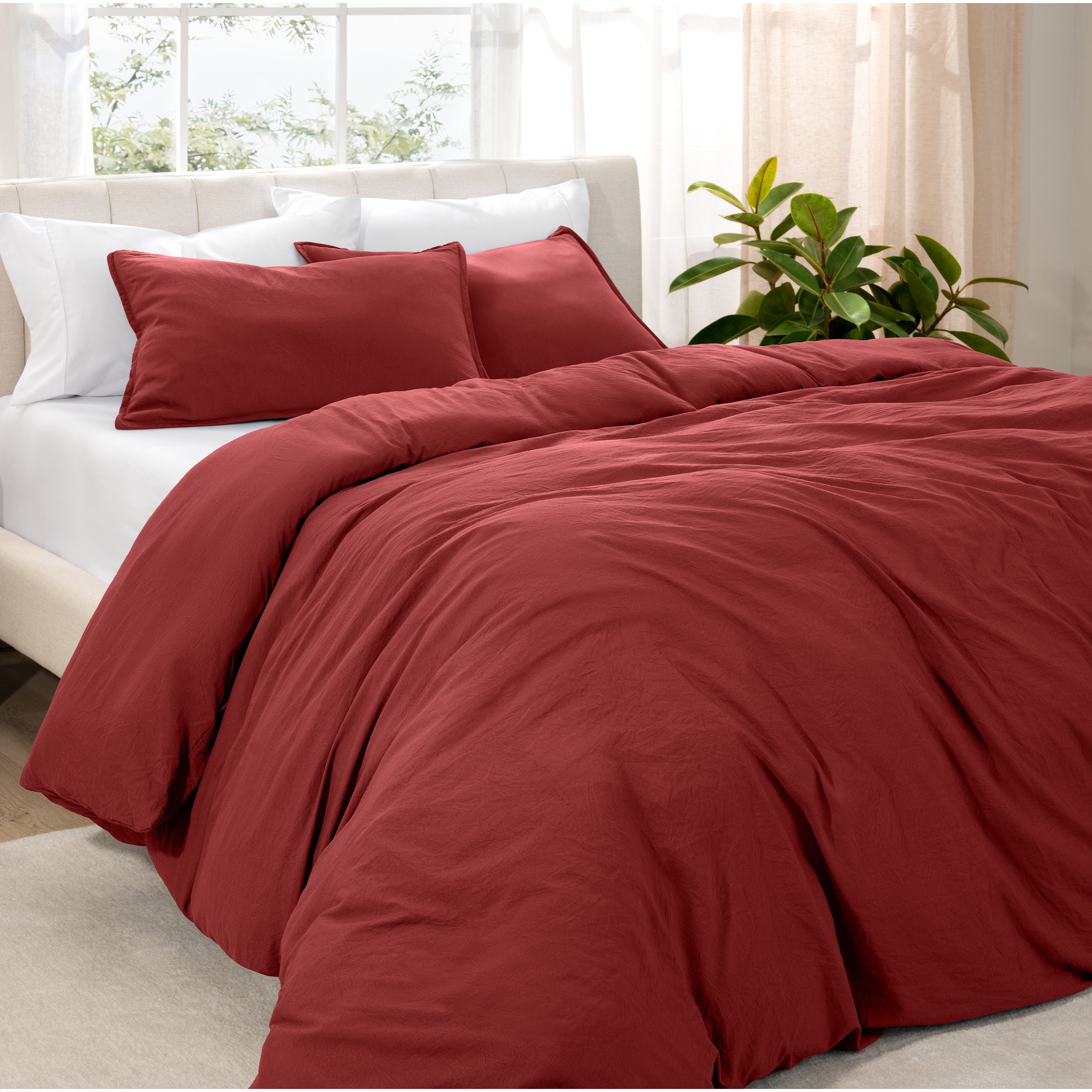 Angled view of bed with a duvet cover folded over on itself