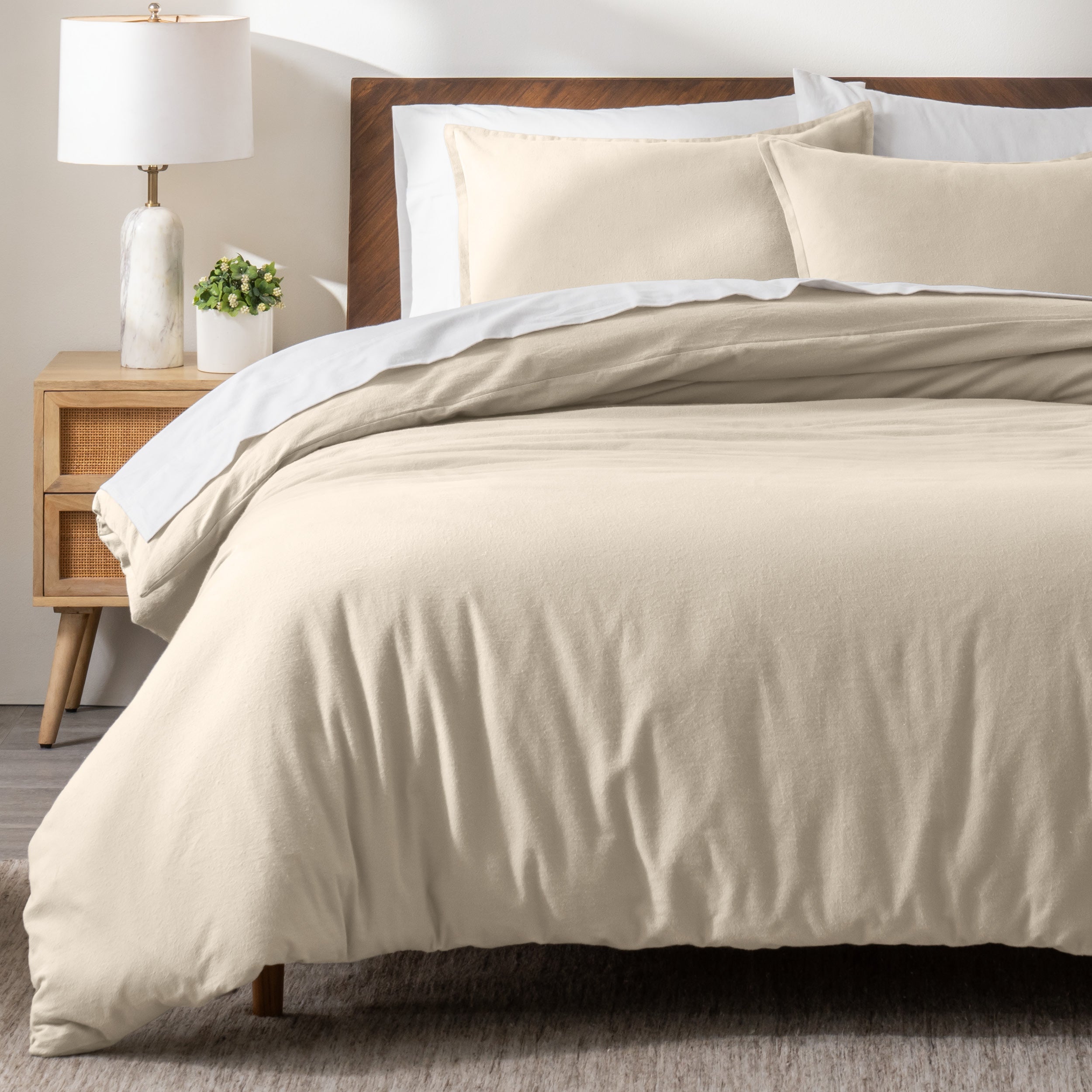 A modern bed with a flannel duvet cover set consisting of the duvet cover and two pillows.