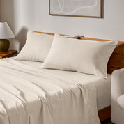A bed made with matching flannel sheets and pillowcases