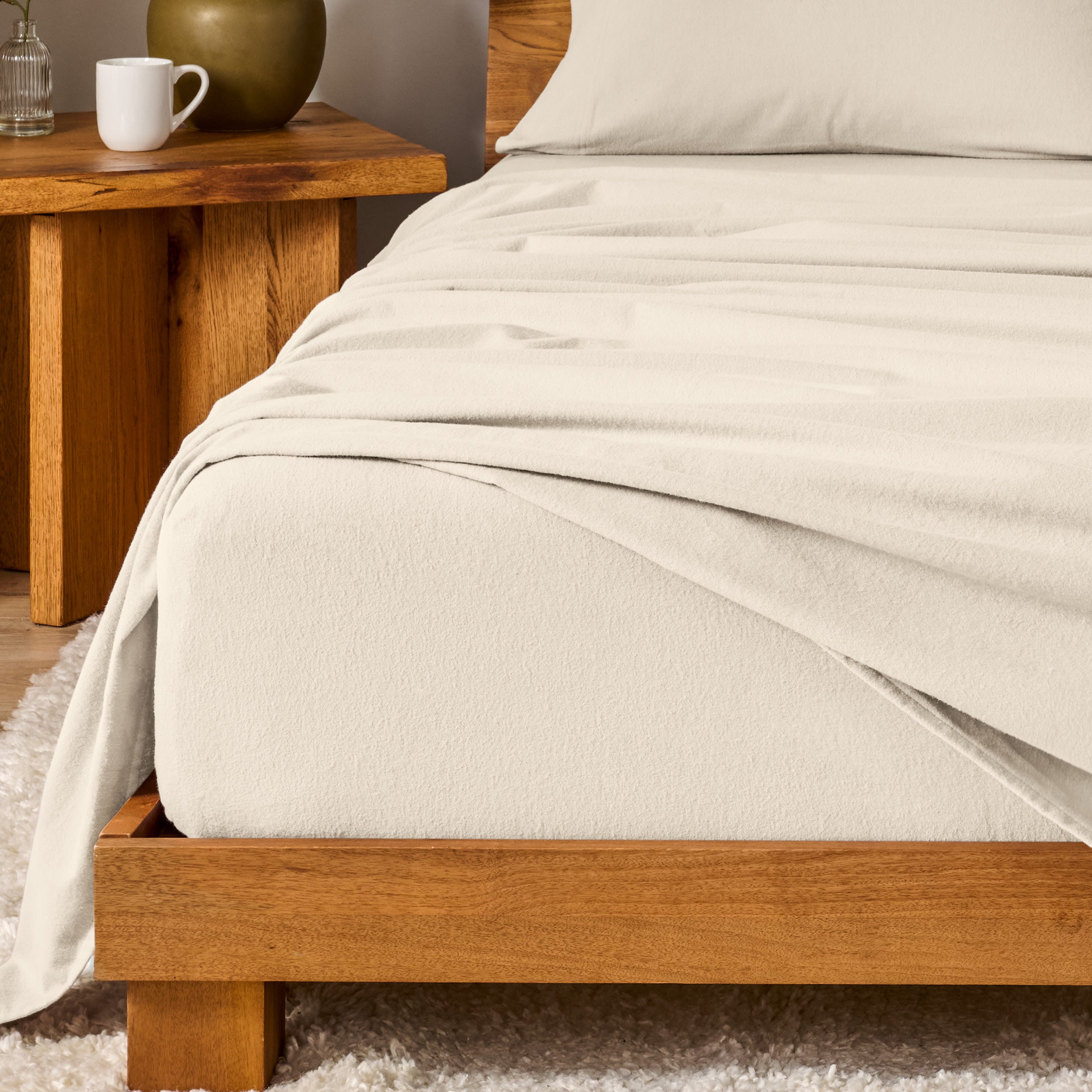 A modern bedroom with cotton flannel sheets on the bed