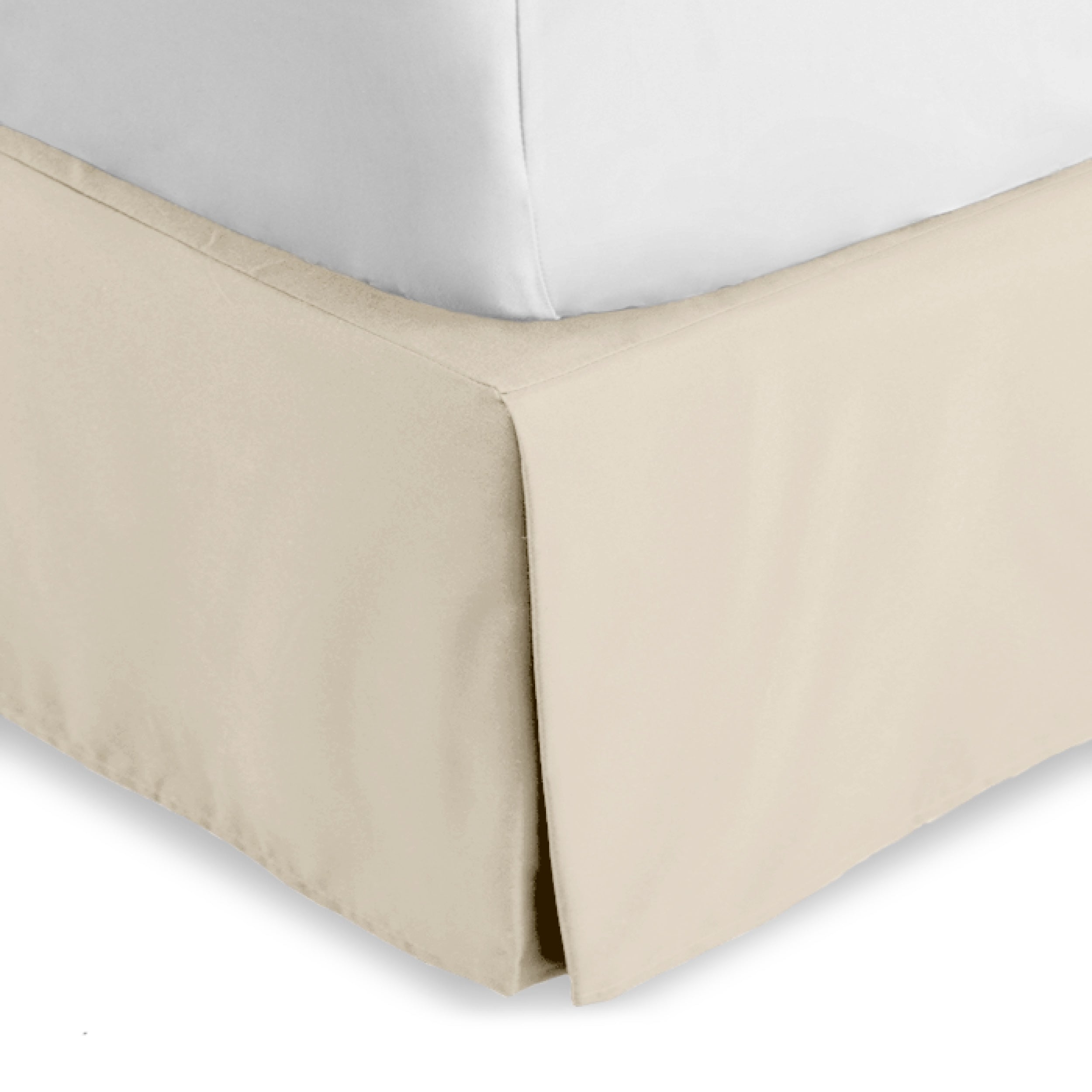 The corner of a bed skirt on a bed frame