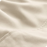 Close-up of the fabric and its neatly finished edge.