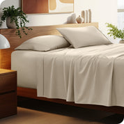 A cozy bedroom featuring a neatly made bed with soft, microfiber sheets